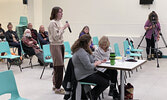 Ruth Broderick (holding microphone) asks a question of the candidates.   Tim Brody / Bulletin Photo