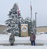 Alzheimer Society of Canada volunteer Betty Lawrence (left) and Sioux Lookout Mayor Doug Lawrance in front of the flagpoles at the Municipal Office where the Alzheimer Society of Canada flag has been raised.     Municipality of Sioux Lookout / Submitted P