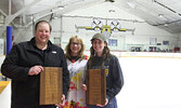 Sioux Lookout Bombers Secretary/Treasurer Christine Hoey (centre) presents the Game-Day Award to Kayleigh Bates (right) and the Board Award to Austen Hoey (left).     Tim Brody / Bulletin Photo