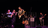 Crash Test Dummies lead singer Brad Roberts hits a guitar riff during the band’s performance.     Tim Brody / Bulletin Photo