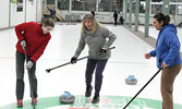 From left: Elizabeth Burke, Tracey Ellek, Komal Shah take part in Curling Day in Canada at the Sioux Lookout Golf and Curling Club.   Tim Brody / Bulletin Photo