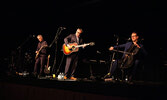 Steven Page (centre) is joined by fellow musicians Craig Northey (left) and Kevin Fox (right) in a sellout performance on Nov. 13 at Sioux North High School.    Tim Brody / Bulletin Photo