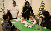 From left: Kingsley Sakchekapo, Shane Sakchekapo, Desiree Hollingsworth, Ava Sakchekapo, and Mary Hollingsworth check out some of the crafting activities.    Tim Brody / Bulletin Photo