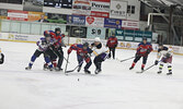 Local police officers and local firefighters in action in last Saturday’s charity hockey game.     Tim Brody / Bulletin Photo