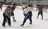 Local police officers and local firefighters in action in last Saturday’s charity hockey game.     Tim Brody / Bulletin Photo