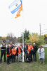 Lac Seul First Nation Chief Clifford Bull (third from right) and Sioux Lookout Mayor Doug Lawrance (second from right) are joined by members of the community following the raising of the survivors flag at the Travel Information Centre on Sept. 29. Tim B