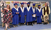 Grade 8 graduates from Waninitawingaang Memorial School from left: Tehya Parenteau, Mitchell Trout, Kobe Meekis, Julian Gray, and Joni Trout. Also pictured are staff members Alisha Dasti-Hill (L) and Sean Tudor (R).   Submitted by Pam Capay