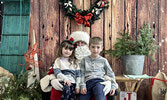 William Kendell, 7, and sister Ellie Kendell, 4, tell Santa Claus what they would like for Christmas.    Tim Brody / Bulletin Photo