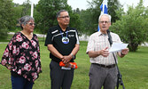 From left: Darlene Angeconeb and Chief Clifford Bull listen as Mayor Doug Lawrance reads his proclamation.   Tim Brody / Bulletin Photo