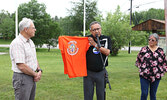 Lac Seul First Nation Chief Clifford Bull (centre) presents Mayor Doug Lawrance (left) with a special t-shirt.   Tim Brody / Bulletin Photo