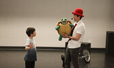 Tim Holland, along with his puppets Crackers the parrot and Julius  the turtle, delighted audience members, some of whom assisted him with his performance.    Tim Brody / Bulletin Photo