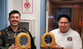 From left: Cst. Tyler Gordon and Administrative Assistant Stephen Gray with the new devices. - Lac Seul Police Service / Submitted Photo