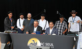 Front row from left: Lac Seul First Nation Chief Clifford Bull and Minister of Crown-Indigenous Relations Gary Anandasangaree sign an agreement settling Lac Seul First Nation’s longstanding flood claim. Back row from left: Lac Seul First Nation Band Counc