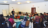 Stand-up comedian, and former social worker and addictions counsellor, Ron Kanutski (back left) facilitated the Living Well Through Laughter workshop. - Jesse Bonello / Bulletin Photo