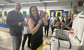 Caitlin Durante shows off the open lock she turned a key to, to win a new Yeti cooler at this year’s Rotary Lobsterfest. The key contest proved quite popular with a long lineup of participants waiting to try their luck opening the lock before Durante’s ke