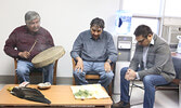 Elders Tom Chisel (left) and Roy Morris (centre) bless MPP Sol Mamakwa’s (right) constituency office. - Tim Brody / Bulletin Photo