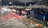 Traffic was steady throughout the evening of Dec. 2 for the Nishnawbe-Gamik Friendship Centre’s Holiday Drive-Thru Feast. Staff were able to serve meals quickly as vehicles moved up to the front of line, ensuring a smooth traffic flow.     Mike Lawrence /