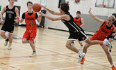 The Sioux Lookout Warriors in action against the Westgate Collegiate and Vocational Institute Tigers in Game 1 of the NWOSSA AA Senior Boys Basketball Championship held at SNHS.     Tim Brody / Bulletin Photo