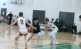 The Sioux North High School Senior Boys Basketball Team (the Warriors) in action against the visiting Westgate Collegiate and Vocational Institute Senior Boys Basketball Team (the Tigers) in game two of the NWOSSA “AA” Basketball Championship.  Tim Brody 