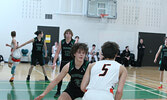 The Sioux North High School Senior Boys Basketball Team (the Warriors) in action against the visiting Westgate Collegiate and Vocational Institute Senior Boys Basketball Team (the Tigers) in game two of the NWOSSA “AA” Basketball Championship.  Tim Brody 