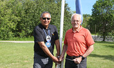 Lac Seul First Nation Chief Clifford Bull (left) and Sioux Lookout Mayor Doug Lawrance raised the Lac Seul First Nation flag at the Travel Information Centre on June 21.    Tim Brody / Bulletin Photo 