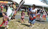 Treaty #3 Gaakinawataagizod (Councillor) Cheyenne Vandermeer (second from right) joins in the powwow at the hospital grounds.    Tim Brody / Bulletin Photo 