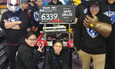 Pelican Falls Robotics Competition Team 6339 with their robot. - Submitted Photo