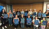 Participants of the Blueberry Theme Painting Tutorial show off their finished artwork. Photo courtesy of Twylla Penner