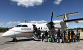 Pikangikum First Nation evacuees board a Perimeter Dash-8 bound for Kapuskasing on June 1. - Tim Brody / Submitted Photo