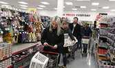 After waiting for the doors to the Red Apple store to open, customers explored the store’s selection of products as they shopped. A ribbon-cutting ceremony preceded the opening of the store.     Tim Brody / Bulletin Photo