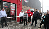 After waiting for the doors to the Red Apple store to open, customers explored the store’s selection of products as they shopped. A ribbon-cutting ceremony preceded the opening of the store.     Tim Brody / Bulletin Photo