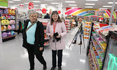 After waiting for the doors to the Red Apple store to open, customers explored the store’s selection of products as they shopped. A ribbon-cutting ceremony preceded the opening of the store.     Tim Brody / Bulletin Photo