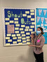 Educator Julia Palumbo of Sioux North High School displays the “Shout Outs” board, which relays positive messages to staff and students.   Sioux North High School / Submitted Photo