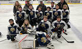The Sioux Storm pose with their trophy after winning gold at the Lake of the Woods U11 Hockey Tournament held in Kenora over the Family Day weekend. Front center- Goalie Ira Maud. Front row from left: Caiden Quequish, Winter Woodrow, Brooks Atwood, Xande