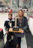 Sioux Storm Defenseman Brooks Atwood (left) stands with mom/Head Coach Karla Madsen as they display the Lake of the Woods U11 Hockey Tournament trophy the team won in Kenora. Karla Madsen / Submitted Photo