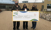 Katherine Beardy (centre) holding her winning cheque, with her partner Mark Boles (left), presented by SLMHC Foundation Vice President  Jackie Duhamel.     Reeti Meenakshi Rohilla / Bulletin Photo