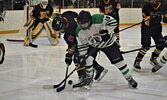 The SNHS Warriors boys’ hockey team battle for an offensive zone faceoff during a playoff game against the Fort Frances Muskies last year. - Jesse Bonello / Bulletin Photo