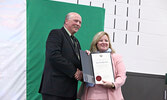 Mercer (left) accepts a congratulatory certificate for the school from Ontario Minister of Education Lisa Thompson. - Tim Brody / Bulletin Photo