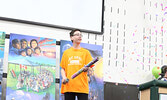 Waninitaawingaang Elementary School grade 8 student Cole Trout blasts confetti into the crowd. - Tim Brody / Bulletin Photo