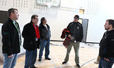 Monteith (far left), Nault (second from left), and Maud (second from right) along with his Councillors  and Education Director, discuss sports programs at the new high school. - Tim Brody / Bulletin Photo