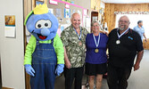 Singles cribbage winners with Blueberry Bert, from left: Blueberry Bert, Duncan Begg, Suzanne Rankin, and John Manno. - Tim Brody / Bulletin Photo