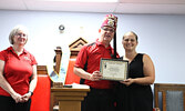 Kelli George-Egerter (right) accepts a certificate of appreciation from Potentate Denis Lorteau on behalf of Bumper to Bumper Sioux-Per Auto Parts, while First Lady Lindsey Lorteau looks on.