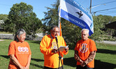 From left: Municipal Truth and Reconciliation Committee Chair Darlene Angeconeb, Lac Seul First Nation Chief Clifford Bull, and Sioux Lookout Mayor Doug Lawrance share messages prior to raising the Survivors Flag at the Travel Information Centre on Sept. 