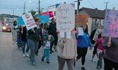 Participants marched through the downtown core carrying signs and calling out messages condemning violence.   Tim Brody / Bulletin Photo