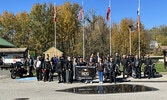 Motorcyclists at this year’s Toys for Tots event pose for a group photo before heading out on a group ride.   Angela Anderson / Bulletin Photo