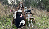 Ghastly sights met those brave enough to traverse the haunted trail during Boo at the Bay. Haunters posed for a group photo at the event’s conclusion.     Tim Brody / Bulletin Photo