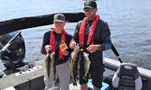 Jennifer Sitar (left) and Brendan Sitar with their day one catches, which totaled 9.16 pounds. - Jesse Bonello / Bulletin Photo