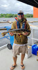 Jason MacDonald with the big fish of the day for Day 1 – 6.14 pounds.      Photo courtesy Sioux Lookout Walleye Weekend