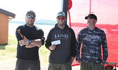 Tournament Coordinator Jeremy Funk presents third prize to the team of Brandon Kamm and Dale Barker.   Tim Brody / Bulletin Photo