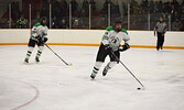 Jerry Fiddler (19) rushes the puck out of the Warriors’ defensive zone. - Jesse Bonello / Bulletin Photo